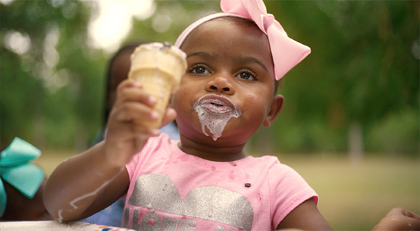 The Burgesses enjoy ice cream in the park.