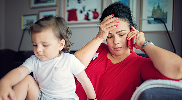 A mom experiencing parent stress calls the Texas Parent helpline for parenting support.